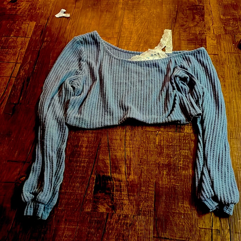 A long sleeve crop top shirt.